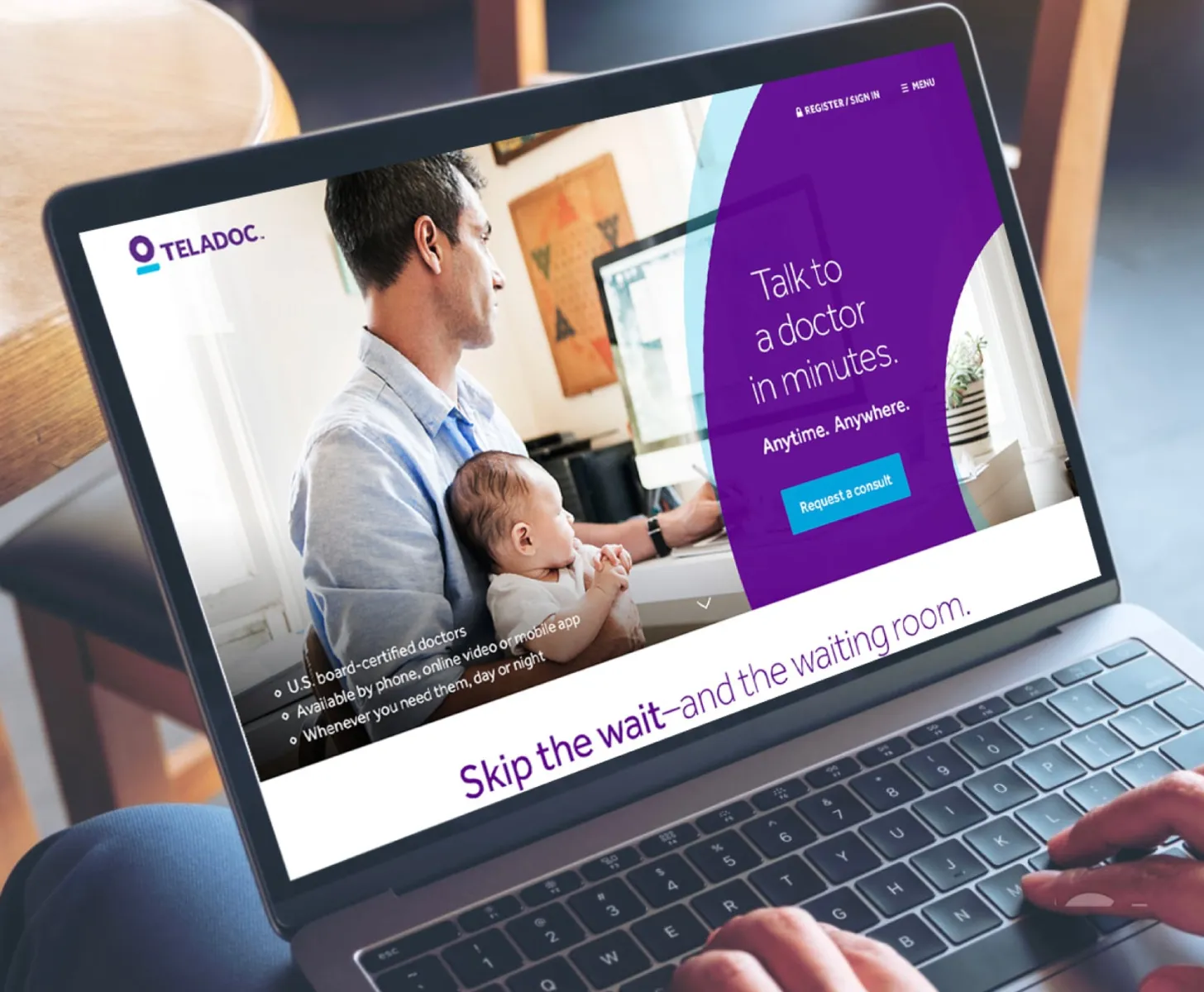 Screen of a webpage showing a father and child consulting with a doctor online